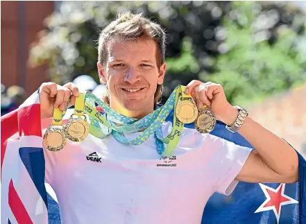  ?? PHOTOSPORT ?? New Zealand cyclist Aaron Gate with his four gold medals won in Birmingham.