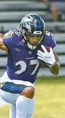  ?? KEVIN RICHARDSON / BALTIMORE SUN ?? There isn’t a more intriguing Ravens player returning from injury this season than running back J.K. Dobbins, columnist Mike Preston writes.