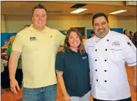  ?? FILE PHOTO ?? Greater Bryant Chamber of Commerce President and CEO Todd Rhoden, left, Taste of Bryant committee chairman Kim Leech and chef Serge Krikorian pose for a photo during last year’s Taste of Bryant at Bishop Park.