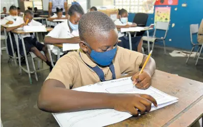  ?? FILE ?? Students write PEP exam. Ronald Thwaites writes: Jamaican children are no less bright than those in Singapore or Japan, with whom we are being compared by PISA. So, why are so many consigned to be less cared underachie­vers ... ?