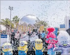  ?? Picture: AP ?? California Governor Gavin Newsom, centre, celebrates with other guests after the Vax for the Win lottery contest during a news conference at Universal Studios in Universal City, California.