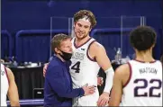  ??  ?? Gonzaga coach Mark Few hugs forward Corey Kispert after Kispert, a senior playing his last home game, left the court near the end of the team’s game Saturday against Loyola Marymount in Spokane, Wash.