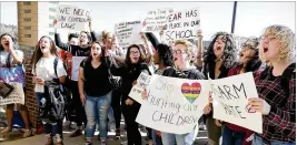  ?? THE WINCHESTER STAR ?? Students from Millbrook High School demonstrat­e Wednesday in Frederick County, Va., against gun violence following the shooting Feb. 14 at Marjory Stoneman Douglas High School in Parkland in which more than a dozen people were killed.