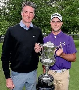  ??  ?? Charlie Smail celebrates his New Zealand amateur men’s golf title win with father David Smail.