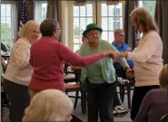  ?? SUBMITTED PHOTO ?? Woodbridge Place residents dance to Irish tunes on St. Patrick’s Day.