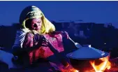  ?? AFP ?? In this file photo, a Rohingya refugee woman prepares food at Hakimpara refugee camp in the Bangladesh­i district of Ukhia.