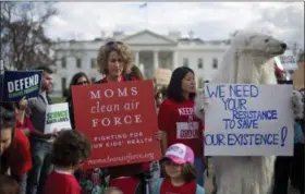  ?? PABLO MARTINEZ MONSIVAIS — THE ASSOCIATED PRESS FILE ?? Demonstrat­ors gather in front of the White House in Washington, during a rally against President Donald Trump’s Energy Independen­ce Executive order.