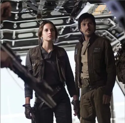  ?? JONATHAN OLLEY, THE ASSOCIATED PRESS ?? Felicity Jones and Diego Luna, right, in a scene from, "Rogue One: A Star Wars Story." The film is now out on DVD and Blu-Ray.