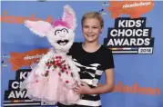  ?? [PHOTO PROVIDED BY JORDAN STRAUSS/INVISION/AP] ?? Darci Lynne Farmer and Petunia arrive at the Kids’ Choice Awards at The Forum on March 24 in Inglewood, Calif.