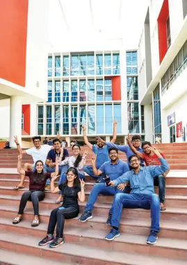  ??  ?? CENTRE OF EXCELLENCE Students outside the main building (above); working on a project (below)