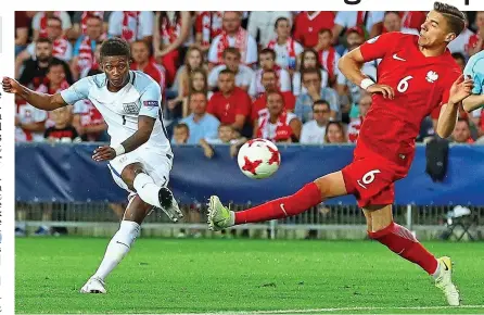  ?? REX ?? Early riser: Demarai Gray curls in from outside the box to put England ahead in the sixth minute