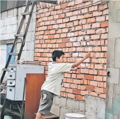  ??  ?? The white-chalked guitar on the wall resembles the death of a person in a crime scene, which is linked to Aiman’s dead brother who introduced the guitar into his life.