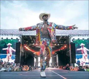  ?? Rick Kern WireImage ?? LIL NAS X, shown performing May 3 at JMBLYA, finds out Monday if he set a record in Billboard history.