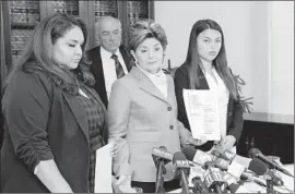  ?? Irfan Khan Los Angeles Times ?? GLORIA ALLRED, center, announces in May 2018 that she would be suing USC and Tyndall on behalf of Angela Esquivel Hawkins, left, and Daniella Mohazab.