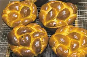  ?? Lake Fong/Post-Gazette ?? Some paska, a type of Easter bread, are cooled down on a rack at St. Gregory's Russian Orthodox Church in Homestead.