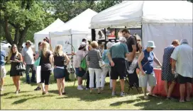  ?? ROYAL OAK TRIBUNE FILE PHOTO ?? People gather at the annual Royal Oak Outdoor Fair at Memorial Park last year. The art fair, recreation programs, classes and other events are set to be canceled this year in response to the COVID-19 pandemic.