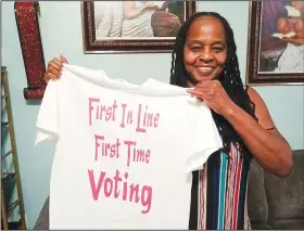  ?? (AP/Rickie Riddle) ?? Betty Riddle of Sarasota, Fla., holds the T-shirt Sunday she wore when she voted for the first time March 17. She was barred from voting in Florida until a federal judge temporaril­y blocked the state from preventing her and 16 other felons from voting because of unpaid legal financial obligation­s.