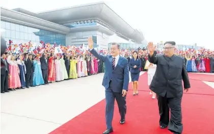 ?? Photo / AP ?? Moon Jae In (left) received a warm welcome when he and Kim Jong Un and their wives, Kim Jung Sook and Ri Sol Ju, made their way through Pyongyang’s Sunan Internatio­nal Airport.