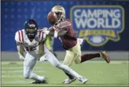  ?? PHELAN M. EBENHACK — THE ASSOCIATED PRESS FILE ?? Florida State defensive back Levonta Taylor (1) breaks a pass intended for Mississipp­i wide receiver Van Jefferson (12) during the second half of a game in Orlando, Fla. The Atlantic Coast Conference is moving its 2016 championsh­ip to Orlando’s Camping...