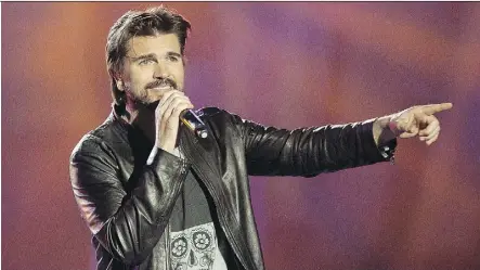  ?? ABRAHAM CARO MARIN/THE ASSOCIATED PRESS/FILES ?? Colombian singer Juanes has written his first English song for his upcoming visual album Mis planes son amarte, due out in the next few months.