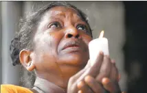  ?? Eranga Jayawarden­a / Associated Press ?? A Sri Lankan Roman Catholic woman outside St. Anthony’s Shrine in Colombo, Sri Lanka, on Tuesday prays during three minutes of nationwide silence for the victims of Easter Sunday’s blasts.