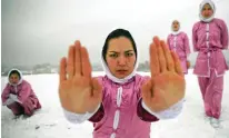  ??  ?? Shaolin martial arts students practice on a hilltop in Kabul, Afghanista­n.