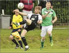  ??  ?? Neill Martin clears his lines as Stephen Morris closes in.