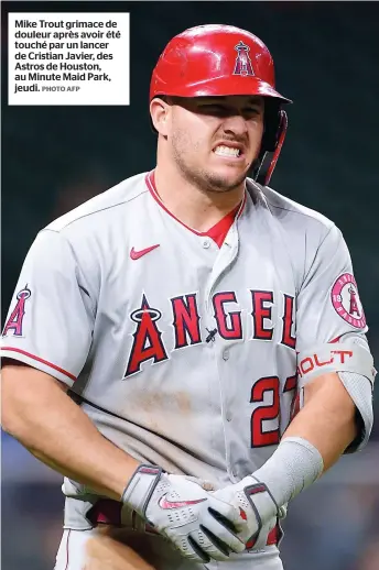  ?? PHOTO AFP ?? Mike Trout grimace de douleur après avoir été touché par un lancer de Cristian Javier, des Astros de Houston, au Minute Maid Park, jeudi.