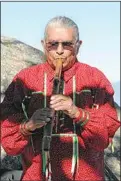  ?? JON HAMMOND / FOR TEHACHAPI NEWS ?? Nuwä elder Luther Girado plays a flute at the dedication of the Kawaiisu Historical Preserve on Bear Mountain.