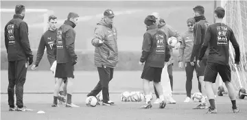  ??  ?? Italy coach Gian Piero Ventura (centre) speaks to his players during training at San Siro in Milan, Italy. — Reuters photo