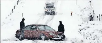  ?? Photo: BARRY HARCOURT. ?? Snowed in: Drivers found conditions challengin­g on the road near Te Anau yesterday morning.