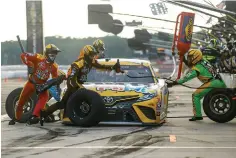  ?? AP Photo/Matt Slocum ?? ■ Kyle Busch makes a pit stop during the NASCAR Cup Series auto race Sunday at Pocono Raceway in Long Pond, Pa.