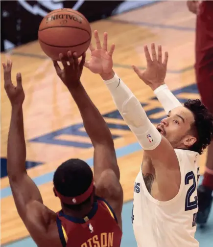  ?? JOE RONDONE/THE COMMERCIAL APPEAL ?? Memphis Grizzlies guard Dillon Brooks defends a shot by Cleveland Cavaliers guard Damyean Dotson during their game at the Fedexforum on Thursday Jan. 7, 2021.