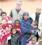  ?? Picture: Lulamile Feni ?? Richard Spoor and his colleague Charles Abrahams, right, at KuKhambi village when visiting the widow, Nozuzile, and children of miner Thembekile Mankayi, whose compensati­on claim for R2.6m became a landmark case.