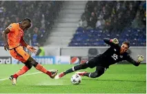  ?? PHOTO: GETTY IMAGES ?? Sadio Mane scores one of his three goals in Liverpool’s 5-0 rout of Porto in the European Champions League last 16 first leg match.