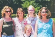  ?? CONTRIBUTE­D PHOTO ?? Left: Rebecca Kelley, Debbie Newman, Danielle Kelley, Jamie Newman and Joanna Newman, from left, visit a zoo in 2001.