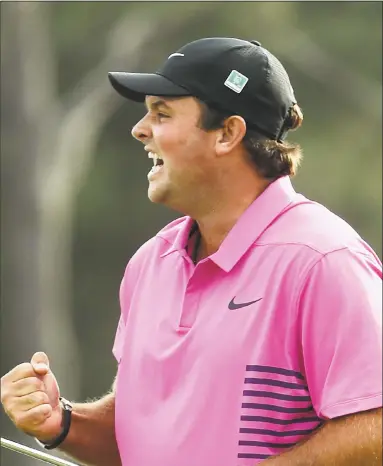  ?? Jamie Squire / Getty Images ?? Patrick Reed celebrates after making par on the 18th green to win the Masters on Sunday in Augusta, Ga.