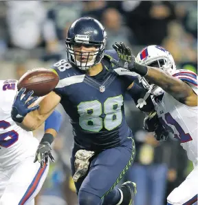  ?? JONATHAN FERREY/GETTY IMAGES ?? Seattle Seahawks tight end Jimmy Graham hauls in a touchdown one-handed during Monday night’s game against the Buffalo Bills in Seattle. Graham had a pair of touchdowns and the Seahawks hung on to defeat the Bills 31-25.
