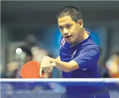  ??  ?? Rungroj Thainiyom competes in table tennis.