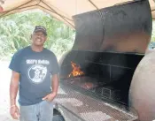  ?? JAN ENGOREN/FORUM PUBLISHING GROUP ?? Troy Davis at his Boynton Beach flagship restaurant. A new Troy’s Barbecue will open in West Palm Beach.