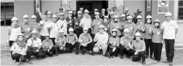  ??  ?? Dr Abdul Rahman (standing front, ninth left) with the village chiefs from Pantai Damai and SPC officials in a group photo at the power plant in Sejingkat.