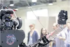  ?? REUTERS ?? Atlas moves its arm during the Darpa Robotics Challenge in Los Angeles in 2015.