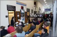  ?? TANIA BARRICKLO — DAILY FREEMAN FILE ?? DEC. 16: The waiting area outside the Department of Motor Vehicles office at the Ulster County Office Building in Kingston overflows with people on the first day undocument­ed immigrants in New York state can start the process of receiving driver’s licenses.