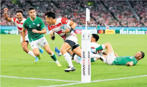  ?? Photo / Getty Images ?? Kenki Fukuoka scores the try that gave Japan the lead against Ireland last night.