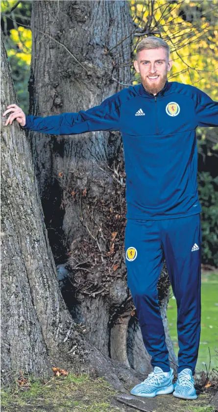  ?? Group. Picture: SNS ?? Oli McBurnie relaxes at the Scotland squad base.