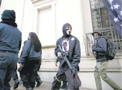  ?? STEPHEN M. KATZ/STAFF ?? People wearing Black Panthers gear and some who said they supported Black Lives Matter showed up at the Capitol on Monday.