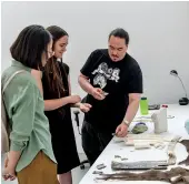  ??  ?? BELOWJesse Tungilik discussing work with artist Nicole Kelly Westman and Stride Gallery Director Areum Kim, 2018 PHOTO JESSICA WITTMAN