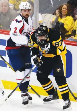  ?? AP PHOTO ?? Pittsburgh Penguins’ Sidney Crosby holds his face after colliding with Washington Capitals’ Matt Niskanen during the first period of Game 6 on Monday.