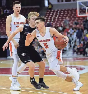  ?? RICK WOOD / MILWAUKEE JOURNAL SENTINEL ?? Kaukauna’s Jordan McCabe drives past Westosha Central’s Nic Frederick during Friday’s game. McCabe was named Mr. Basketball by the WBCA earlier Friday. Story on 10B.