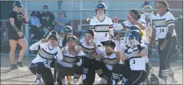  ?? CHRIS RILEY/TIMES-HERALD ?? American Canyon's softball team pretends to take photos of Raegan Jackson after Jackson smacked one of two home runs in a 17-4win over Antioch.